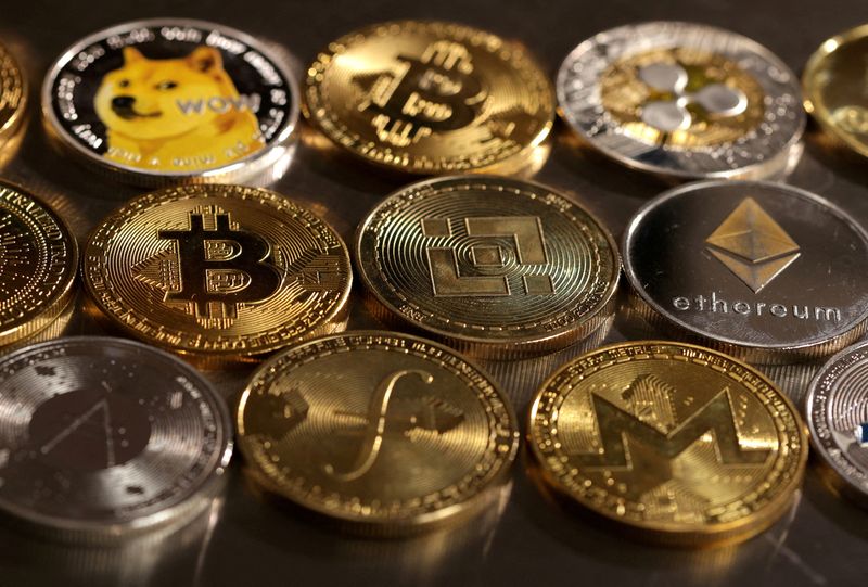 FILE PHOTO: Representations of cryptocurrencies are seen in this illustration created on August 10, 2022. REUTERS/Dado Ruvic/Illustration/File Photo
