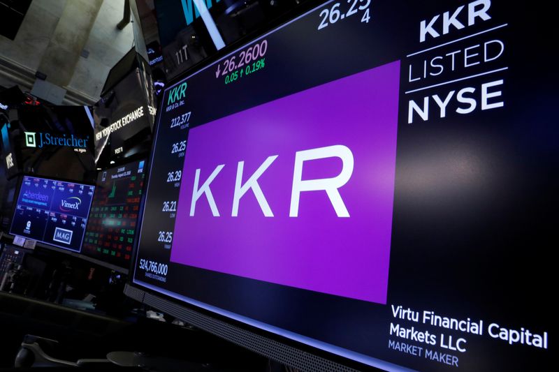 FILE PHOTO: Trading information for KKR & Co is displayed on a screen on the floor of the New York Stock Exchange (NYSE) in New York, U.S., August 23, 2018. REUTERS/Brendan McDermid/File photo