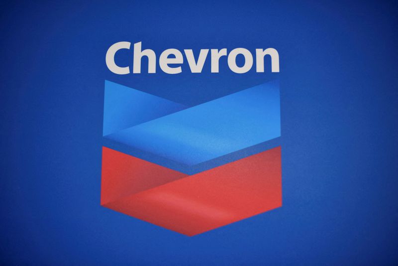 FILE PHOTO: The Chevron logo is pictured after the U.S. government granted a six-month license allowing Chevron to boost oil output in U.S.-sanctioned Venezuela, in Caracas, Venezuela, December 2, 2022. REUTERS/Gaby Oraa/File Photo