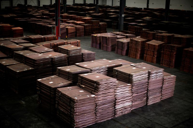 FILE PHOTO: Copper cathodes are seen inside a warehouse near Yangshan Deep Water Port, south of Shanghai March 23, 2012.  REUTERS/Carlos Barria/File Photo