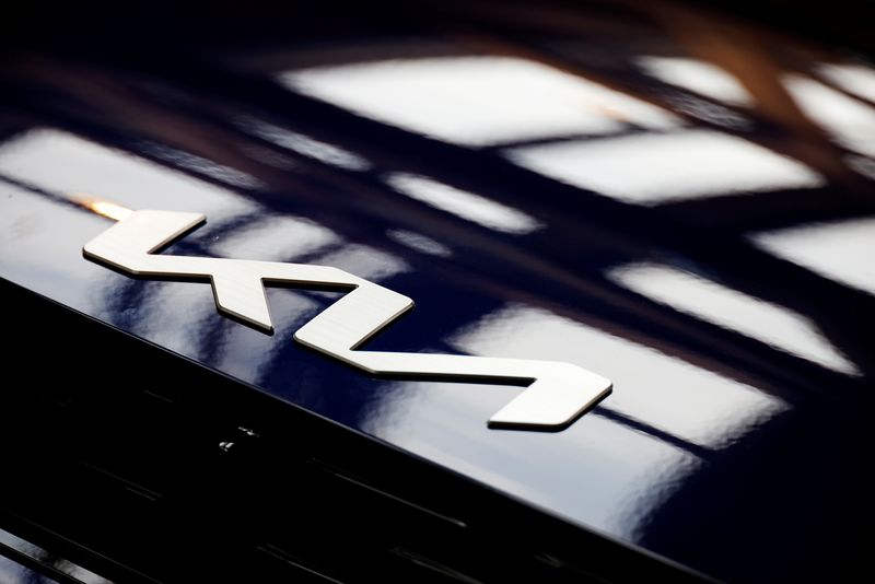FILE PHOTO: The logo of Kia Corp is seen on its electric vehicle EV6 during a photo opportunity in Seoul, South Korea, June 1, 2021. Picture taken on June 1, 2021.   REUTERS/Kim Hong-Ji/File photo