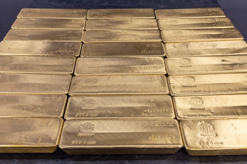 FILE PHOTO: Gold bars are pictured at the plant of gold and silver refiner and bar manufacturer Argor-Heraeus in Mendrisio, Switzerland, July 13, 2022. REUTERS/Denis Balibouse/File photo