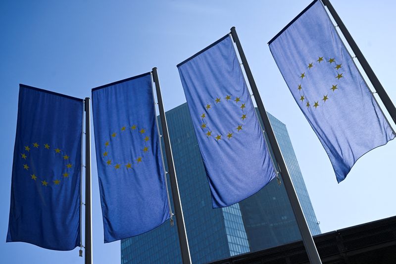 FILE PHOTO: EU flags hang outside the European Central Bank (ECB) headquarters in Frankfurt, Germany, March 6, 2025. REUTERS/Jana Rodenbusch/File Photo
