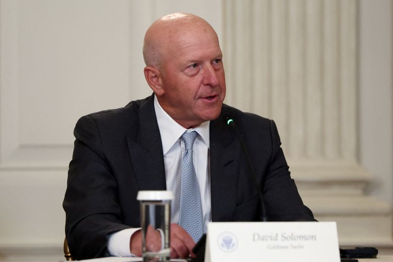 FILE PHOTO: CEO of Goldman Sachs David Solomon participates an Invest America Roundtable in the State Dining room, at the White House, in Washington, U.S., June 9, 2025. REUTERS/Evelyn Hockstein/File Photo
