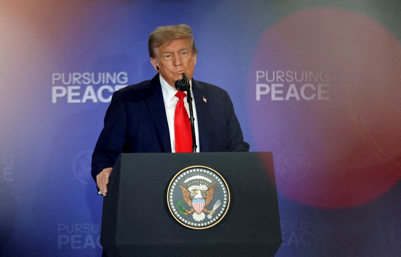 U.S. President Donald Trump holds a press conference with Russian President Vladimir Putin following their meeting to negotiate an end to the war in Ukraine, at Joint Base Elmendorf-Richardson in Anchorage, Alaska, U.S., August 15, 2025. REUTERS/Jeenah Moon