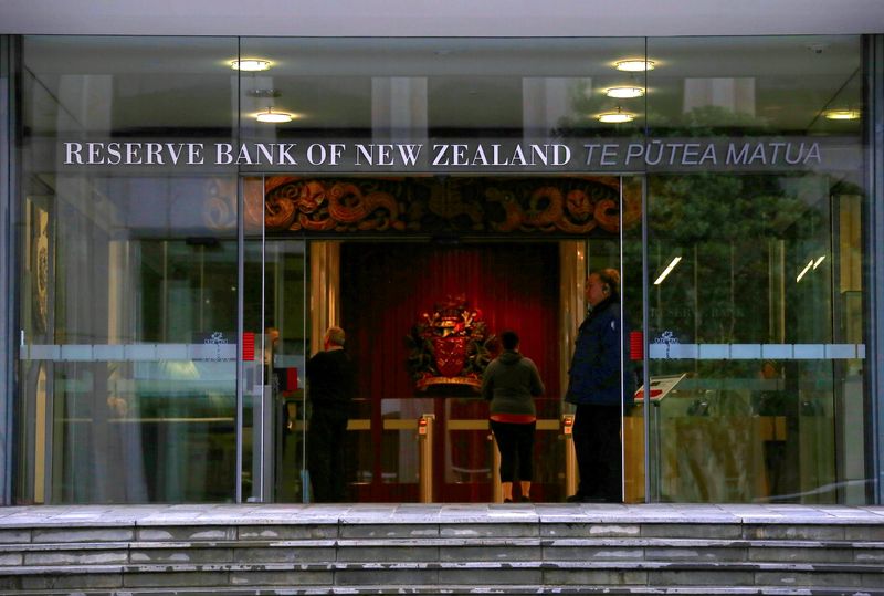 FILE PHOTO: A security guard stands in the main entrance to the Reserve Bank of New Zealand located in central Wellington, New Zealand, July 3, 2017. REUTERS/David Gray/ File Photo