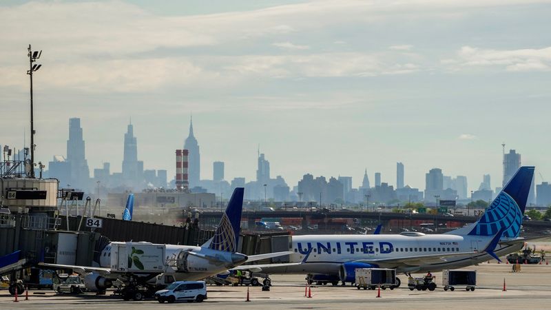 A view shows United Airlines planes at the tarmac at Newark International Airport, as the skyline of New York is seen in the background from Newark, New Jersey, U.S., May 7, 2025. REUTERS/Eduardo Munoz