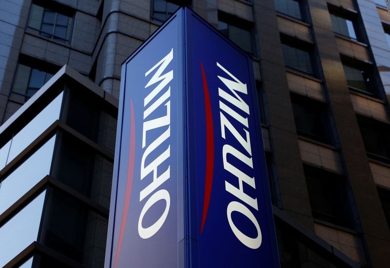 FILE PHOTO: Mizuho Bank's signboard is pictured in Tokyo, Japan, January 25, 2017. Picture taken January 25, 2017.  REUTERS/Kim Kyung-Hoon/File photo