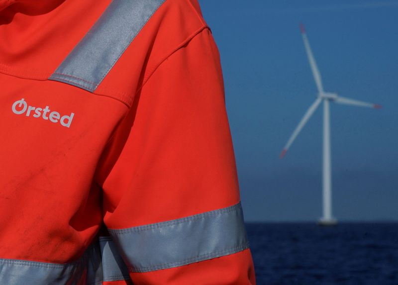 FILE PHOTO: The logo for Orsted can be seen on the jacket worn by an employee as he talks to journalists during a visit to the offshore wind farm near Nysted, Denmark, September 4, 2023. REUTERS/Tom Little/File Photo