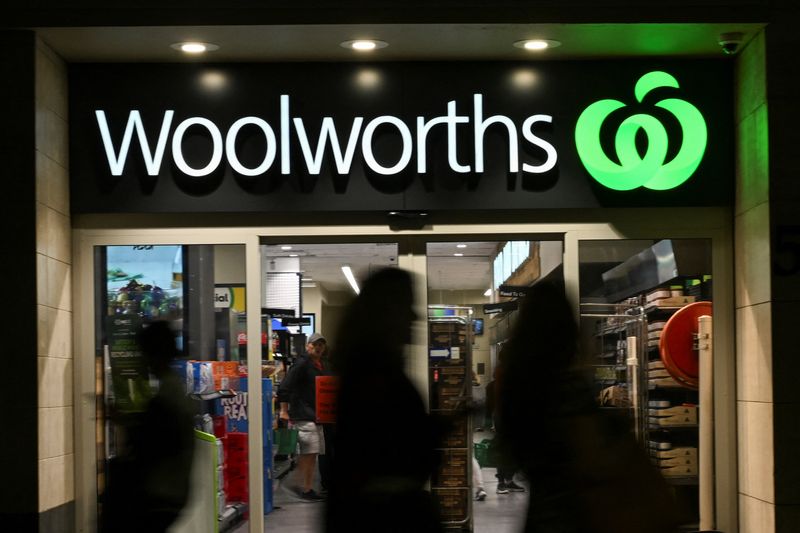 FILE PHOTO: People walk past a Woolworths supermarket in the Sydney Central Business District in Sydney, Australia, May 14, 2024. REUTERS/Jaimi Joy/File Photo