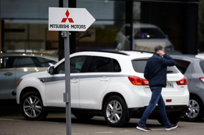 FILE PHOTO: A logo of Mitsubishi Motors is seen outside a dealership in Saint-Herblain near Nantes, France, February 2, 2023. REUTERS/Stephane Mahe/ File Photo