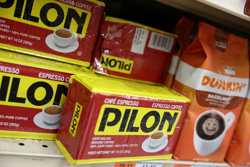 FILE PHOTO: Packs of Pilon and Dunkin' coffee, brands owned by The J.M. Smucker Company, are seen for sale in a store in Manhattan, New York City, U.S., November 22, 2021. REUTERS/Andrew Kelly/File Photo