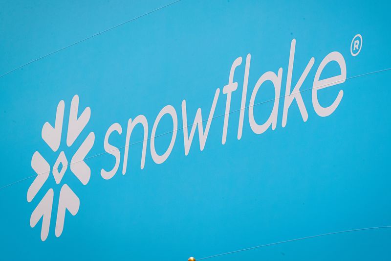 FILE PHOTO: The company logo for Snowflake Inc. is displayed on a banner to celebrate the company's IPO at the New York Stock Exchange (NYSE) in New York, U.S., September 16, 2020. REUTERS/Brendan McDermid/File Photo