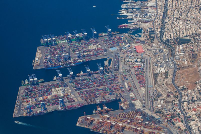 FILE PHOTO: An aerial view of Cosco container terminals in Perama suburb of Piraeus, taken on May 19, 2025. REUTERS/Louisa Gouliamaki/File Photo