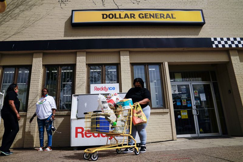 FILE PHOTO: A person exits a Dollar General store in Mount Rainier, Maryland, U.S., June 1, 2021. REUTERS/Erin Scott/File Photo