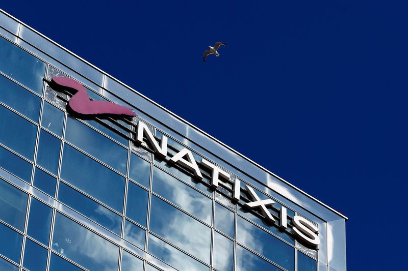 FILE PHOTO: The logo of French bank Natixis is seen at one of their office in Paris, France, April 7, 2021. REUTERS/Gonzalo Fuentes/File Photo