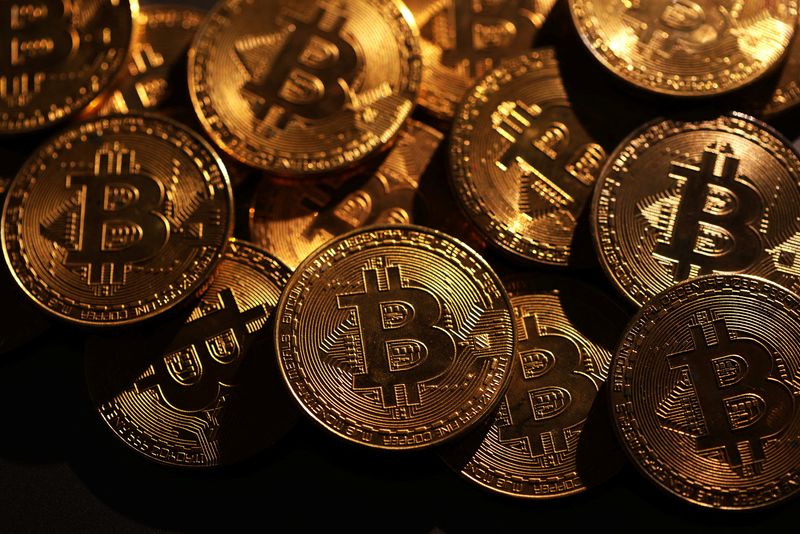 FILE PHOTO: Representations of cryptocurrency Bitcoin are seen in this illustration taken November 25, 2024. REUTERS/Dado Ruvic/Illustration/File Photo