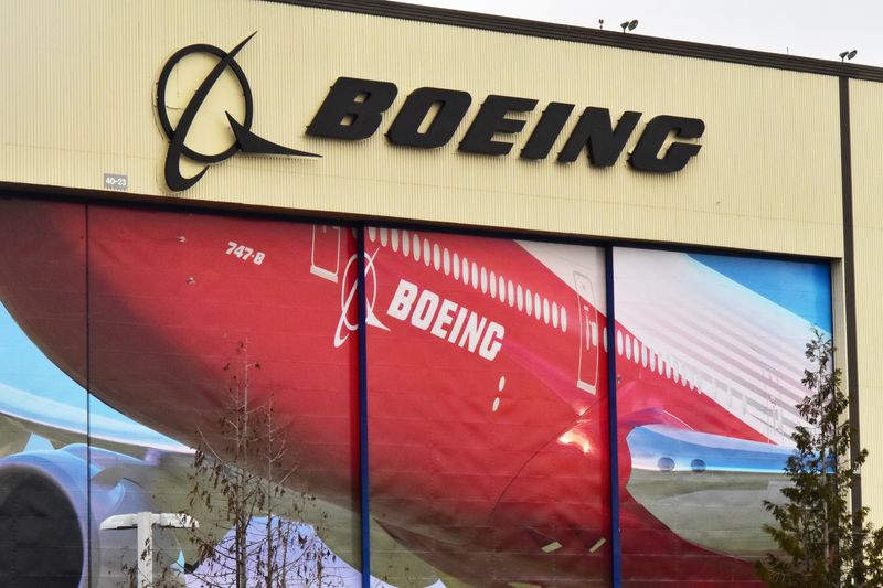 Boeing Co's logo is seen above the front doors of its largest jetliner factory in Everett, Washington, U.S. January 13, 2017. REUTERS/Alwyn Scott/ File Photo