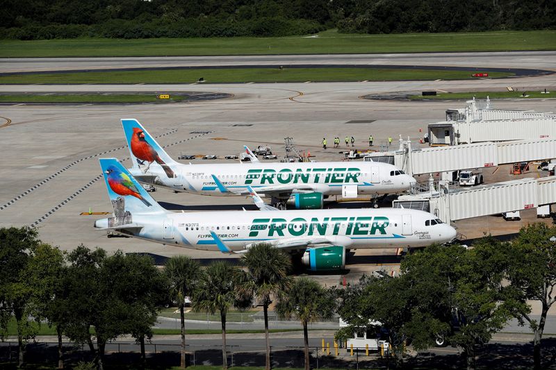 FILE PHOTO: Frontier airlines planes are parked at the boarding gates at Tampa International Airport in Tampa, Florida, U.S., July 19, 2024. REUTERS/Octavio Jones/File Photo