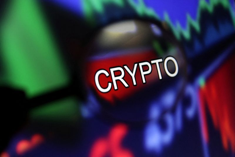 Word "Crypto" and stock graph are seen through magnifier displayed in this illustration taken September 4, 2022. REUTERS/Dado Ruvic/Illustration/ File Photo