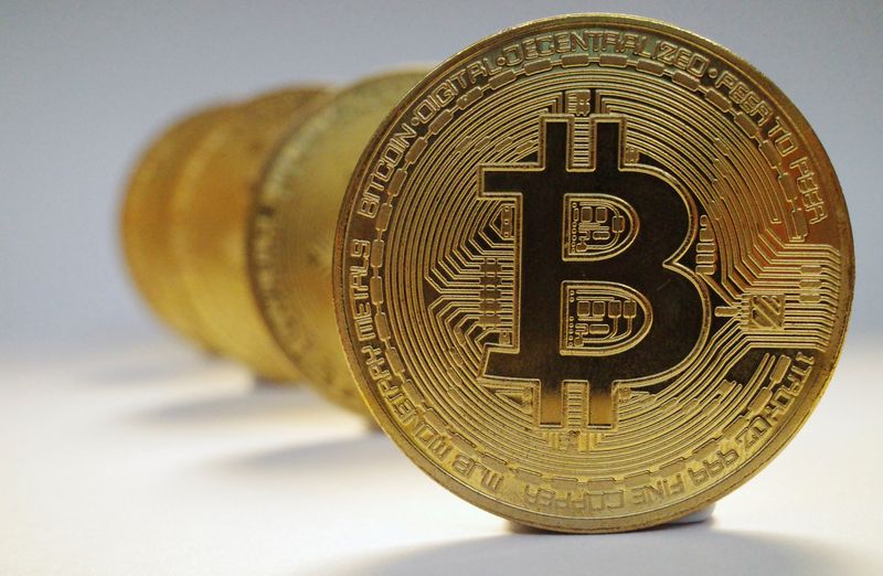 FILE PHOTO: A representation of the virtual cryptocurrency Bitcoin is seen in this picture illustration taken October 19, 2021. REUTERS/Edgar Su/File Photo