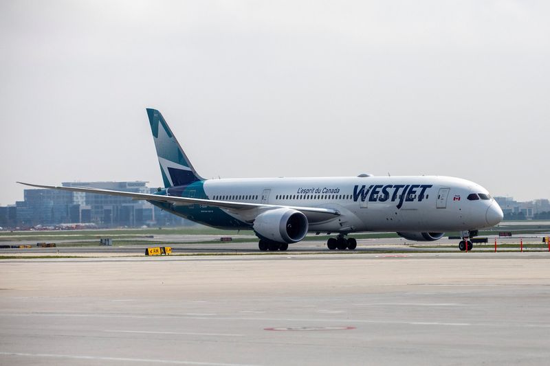 FILE PHOTO: A WestJet Boeing 787-9 Dreamliner airplane taxis along a runway at Toronto Pearson Airport in Mississauga, Ontario, Canada April 28, 2021. REUTERS/Carlos Osorio/File Photo
