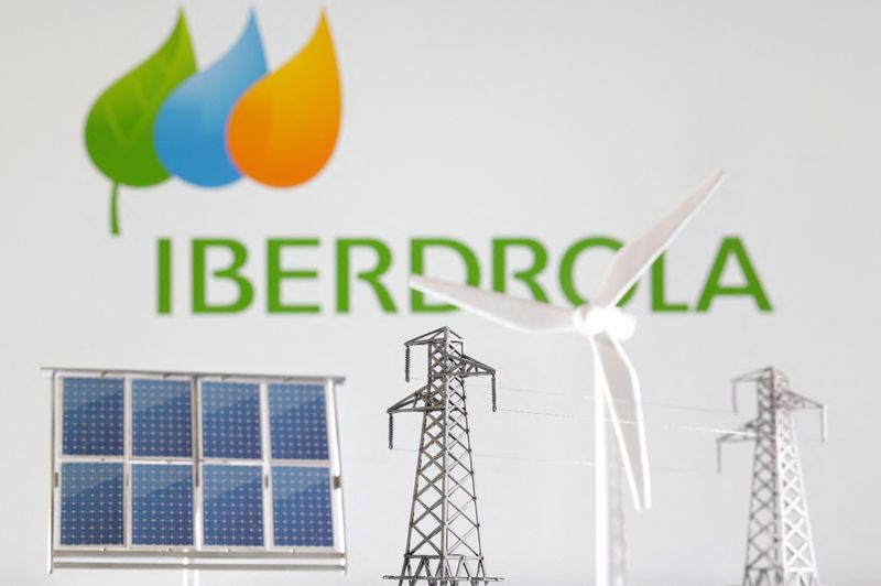 Miniatures of windmill, solar panel and electric pole are seen in front of Iberdrola Renewables logo in this illustration taken January 17, 2023. REUTERS/Dado Ruvic/Illustration/ File Photo