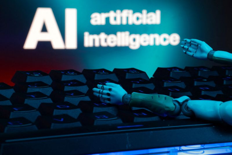 A message reading "AI artificial intelligence", a keyboard, and robot hands are seen in this illustration taken January 27, 2025. REUTERS/Dado Ruvic/Illustration/ File Photo