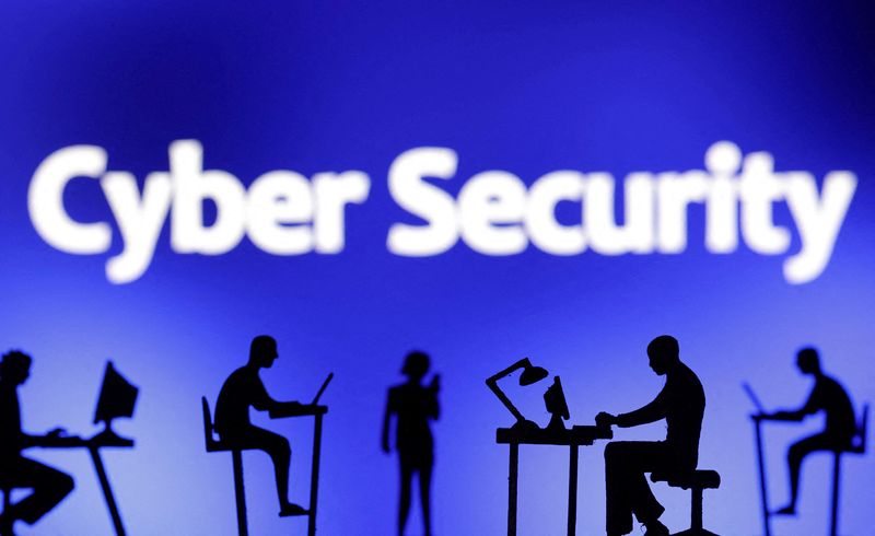 FILE PHOTO: Figurines with computers and smartphones are seen in front of the words "Cyber Security" in this illustration taken, February 19, 2024. REUTERS/Dado Ruvic/Illustration/File Photo