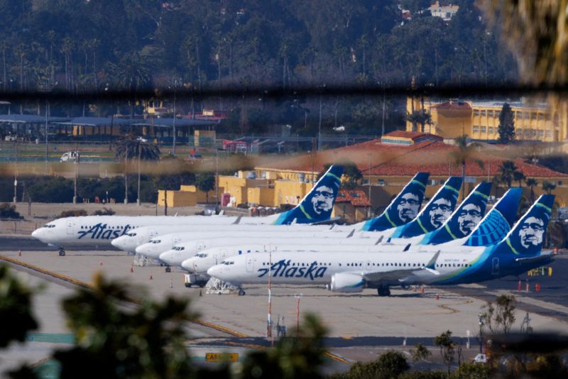 FILE PHOTO: Alaska Airlines commercial airplanes are shown parked off to the side of the airport in San Diego, California, U.S. January 18, 2024.  REUTERS/Mike Blake/File Photo