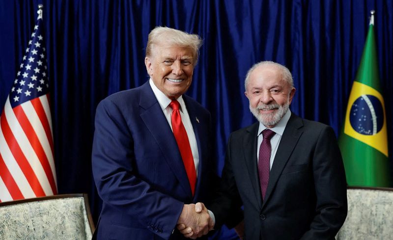 U.S. President Donald Trump and Brazilian President Luiz Inacio Lula da Silva shake hands as they meet on the sidelines of the 47th Association of Southeast Asian Nations (ASEAN) summit in Kuala Lumpur, Malaysia, October 26, 2025. Ricardo Stuckert/Brazil Presidency/Handout via REUTERS