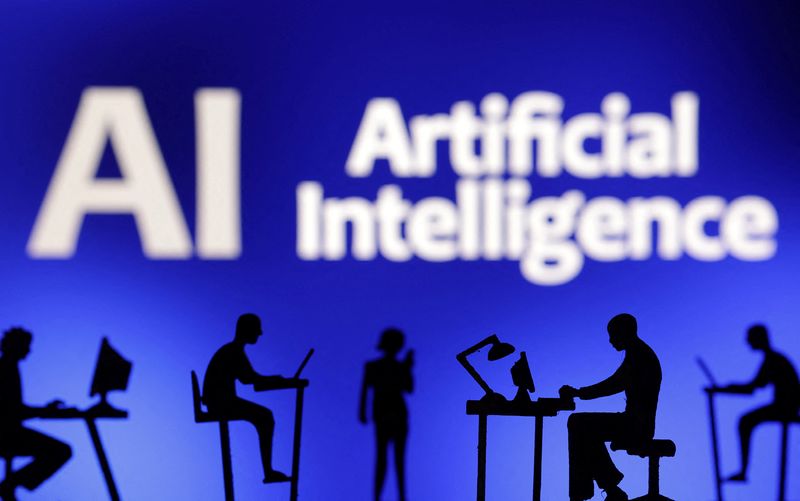 Figurines with computers and smartphones are seen in front of the words "Artificial Intelligence AI" in this illustration taken, February 19, 2024. REUTERS/Dado Ruvic/Illustration