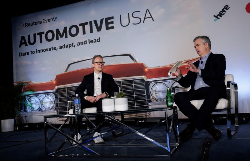 Volkswagen Group of America President and CEO Kjell Gruner speaks with Reuters News Corporate Regulations Reporter David Shepardson during the Reuters Automotive USA event in Detroit, Michigan, U.S. October 29, 2025. REUTERS/Rebecca Cook