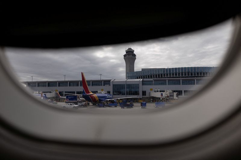 An air traffic control tower at Portland International Airport as the U.S. government shutdown continues in Portland, Oregon, U.S., October 8, 2025. REUTERS/Carlos Barria