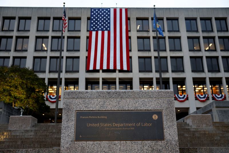 FILE PHOTO: An American flag hangs on the U.S. Department of Labor headquarters, in Washington, D.C., U.S., September 16, 2025. REUTERS/Daniel Becerril/File Photo