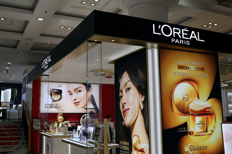 FILE PHOTO: A L'Oreal sign is displayed at the beauty products section of a department store inside a shopping mall in Beijing, China June 10, 2025. REUTERS/Florence Lo/File Photo