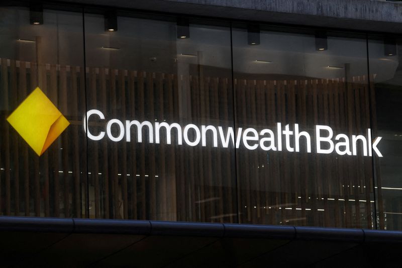 FILE PHOTO: A Commonwealth Bank of Australia (CBA) logo is displayed above a branch in Sydney, Australia, October 15, 2025. REUTERS/Hollie Adams/File Photo