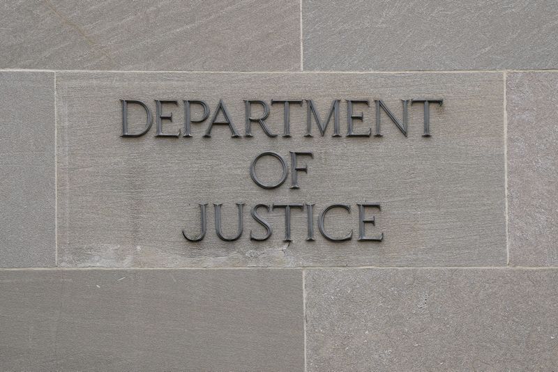 A sign on the wall of the U.S. Department of Justice building in Washington, D.C., U.S., November 14, 2025. REUTERS/Elizabeth Frantz