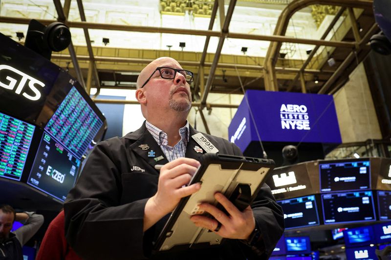 Traders work on the floor at the New York Stock Exchange (NYSE) in New York City, U.S., November 25, 2025.  REUTERS/Brendan McDermid