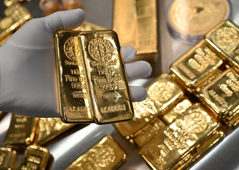 Gold bars are stacked in the safe deposit boxes room of the Pro Aurum gold house in Munich, Germany, January 10, 2025. REUTERS/Angelika Warmuth
