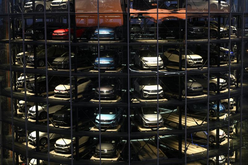 A Volkswagen car delivery tower at the German carmaker's plant in Wolfsburg, Germany, November 21, 2025. Photo taken through glass.   REUTERS/Annegret Hilse