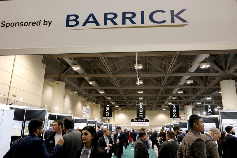 FILE PHOTO: People visit a section sponsored by Barrick Mining Corporation at the Prospectors and Developers Association of Canada (PDAC) annual conference in Toronto, Ontario, Canada March 7, 2023. REUTERS/Chris Helgren/File Photo/File Photo