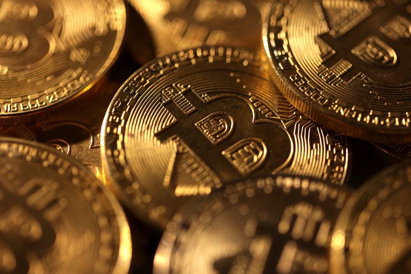 FILE PHOTO: Representations of cryptocurrency bitcoin are seen in this illustration taken November 25, 2024. REUTERS/Dado Ruvic/Illustration/File Photo