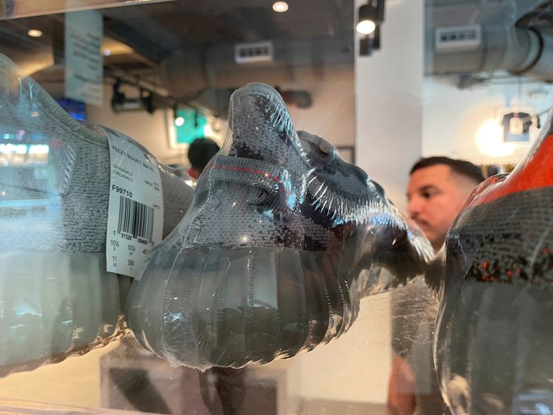 FILE PHOTO: Adidas Yeezy shoes are seen in a store on the day Adidas terminated its partnership with the American rapper and designer Kanye West, now known as Ye, in Garden City, New York, U.S., October 25, 2022. REUTERS/Shannon Stapleton/File Photo