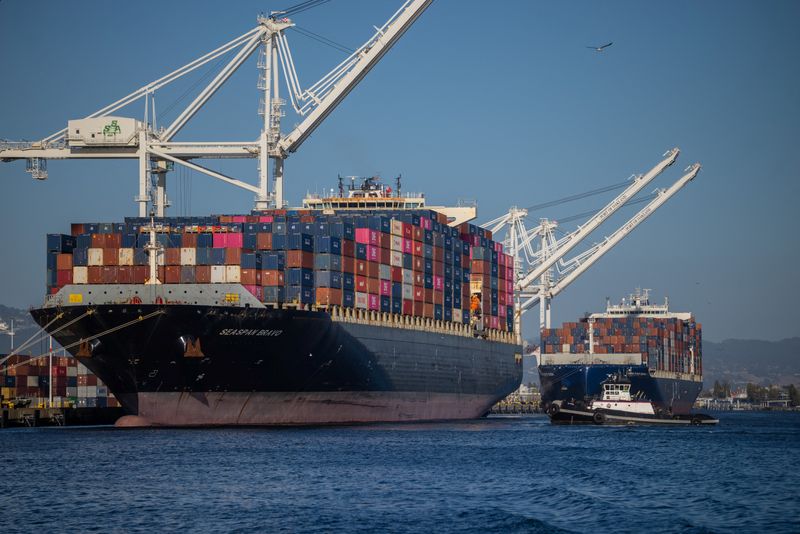 A cargo ship full of shipping containers is seen at the port of Oakland, California, U.S., August 4, 2025. REUTERS/Carlos Barria