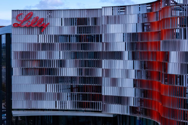 A drone view shows the Eli Lilly logo on one of the company’s offices after it hit $1 trillion in market value on Friday, becoming the first drugmaker to join the exclusive club dominated by tech giants and underscoring its rise as a weight-loss powerhouse, in San Diego, California, U.S., November 21, 2025. REUTERS/Mike Blake
