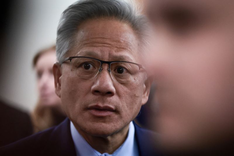 Nvidia founder and CEO Jensen Huang speaks with the media ahead of a meeting with the Senate Banking Committee on Capitol Hill in Washington, D.C., U.S., December 3, 2025. REUTERS/Evelyn Hockstein