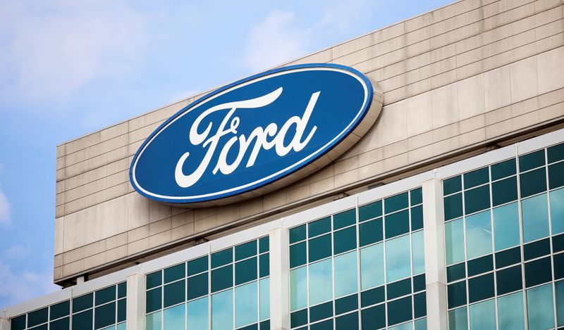 A Ford logo is seen on the Ford Motor World headquarters in Dearborn, Michigan, U.S., March 12, 2025. REUTERS/Rebecca Cook