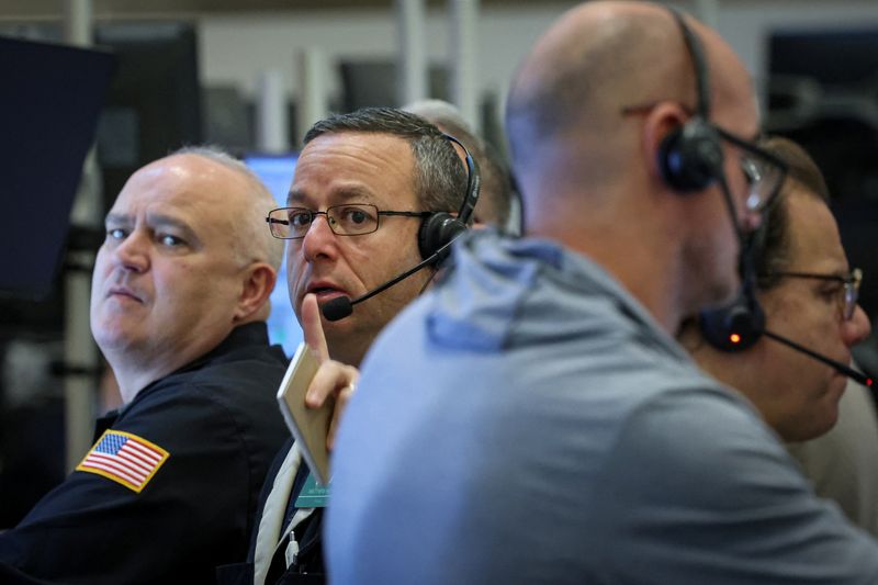 Futures-options traders work on the floor at the New York Stock Exchange's NYSE American (AMEX) in New York City, U.S., December 15, 2025.  REUTERS/Brendan McDermid