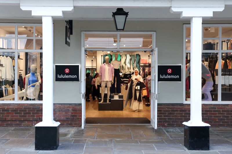 FILE PHOTO: A woman shops inside a Lululemon outlet retail store at Bicester Village in Oxfordshire, Britain, August 21, 2024. REUTERS/Hollie Adams/File Photo